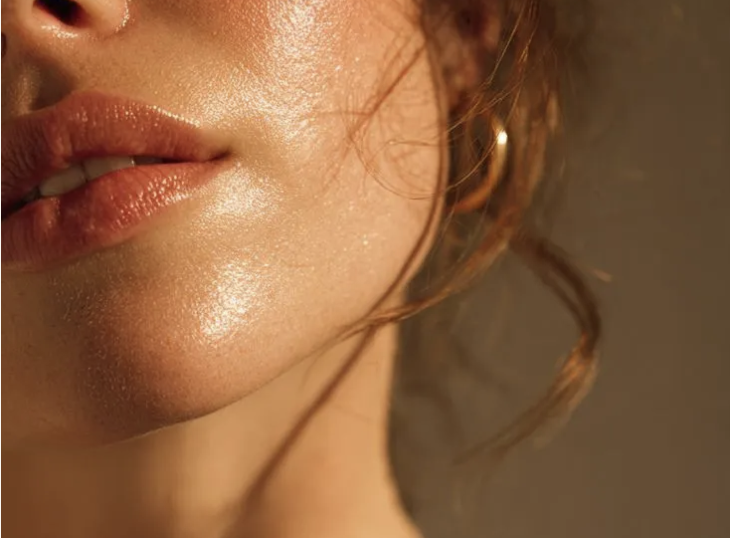 Close-up of glowing skin on the cheek and jawline